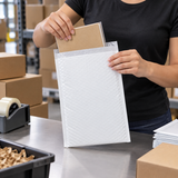 Size #4 poly bubble mailer in use at a commercial packing station
