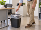 Garbage Bags - 26" x 36" - Clear - X-Strong - 15-20 gal - 125/Case fitted open in a smaller opaque waste bin in an office workroom