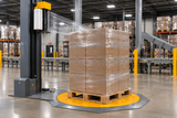 Machine stretch wrap feeding from the left-side carriage around a palletized load