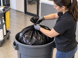 Garbage Bags - 42" x 48" - Black - Strong - 50-55 gal - 100/Case fitted in a commercial waste bin