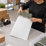 Size #6 poly bubble mailer in use at a commercial packing station