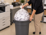 Garbage Bags - DuraPlus - Clear - Strong - 35" x 50" - 125/Case closed clear bag being removed from an opaque commercial waste bin